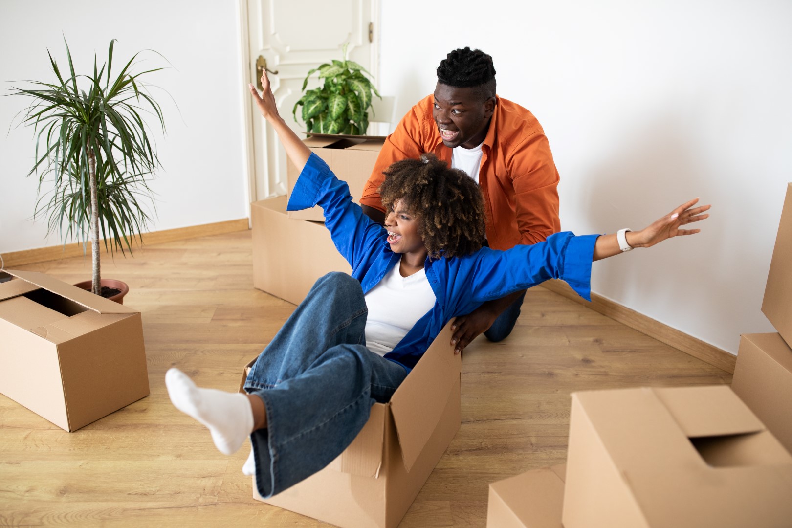 couple playing with empty boxes